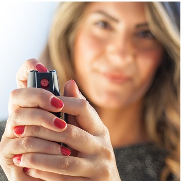 Woman holding pepper spray